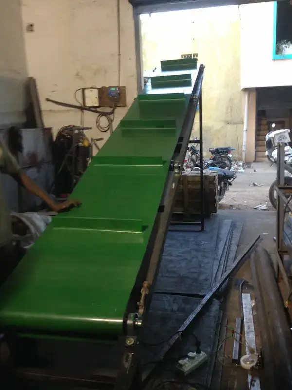 Trough type belt conveyor for handling bulk materials in India